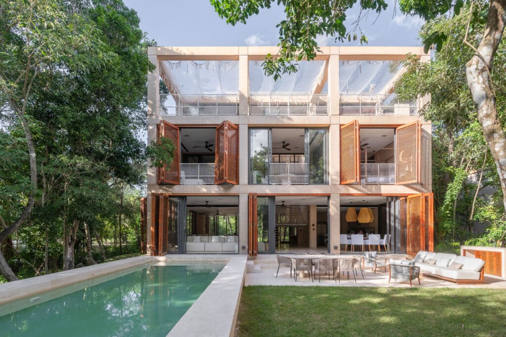 exterior view of Palm Villas house with pool and lounge area